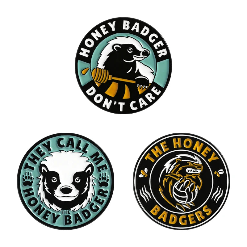 A set of enamel pins featuring designs of a rude middle finger and a daisy flower.