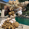 A display of boho brown latex balloons in neutral shades for a baby shower or birthday decoration.