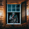 A horror carnival clown figure with green hair and bloodstains is displayed in a window frame.