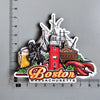 A collection of wooden fridge magnets featuring iconic Boston landmarks including the Golden Gate Bridge, a historic lighthou