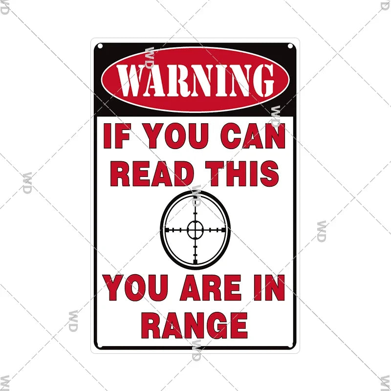 A vintage red and black warning sign with white text that reads WARNING IF YOU CAN READ THIS YOU ARE IN RANGE