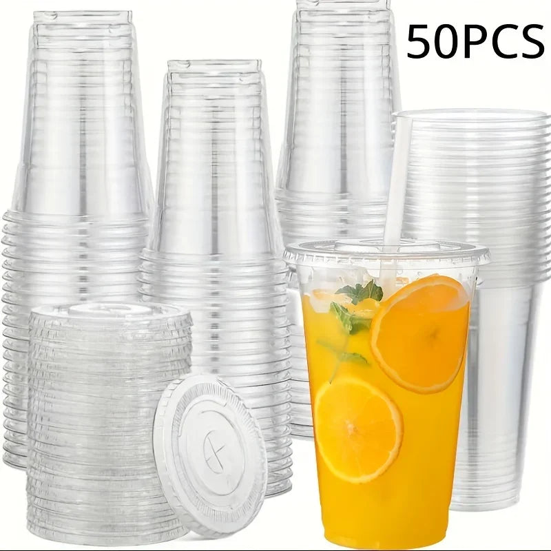 A collection of clear disposable plastic cups with lids and a glass of orange juice are shown.
