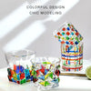 A collection of colorful faceted crystal whiskey glasses displayed on a white surface.