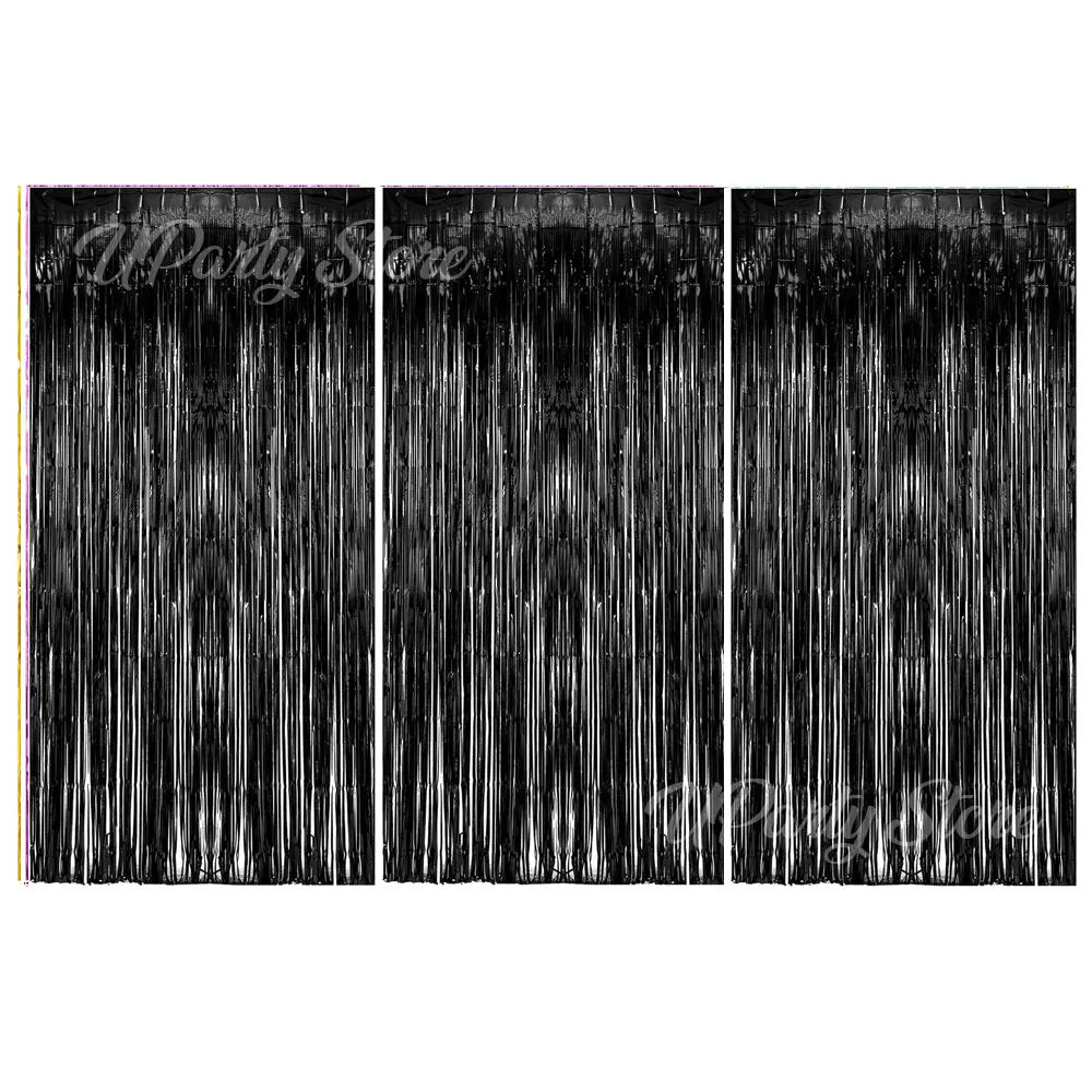 Three vertical panels of metallic foil fringe curtains used as a party backdrop decor.