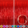 A set of metallic foil tinsel fringe backdrop featuring various colors hanging vertically.