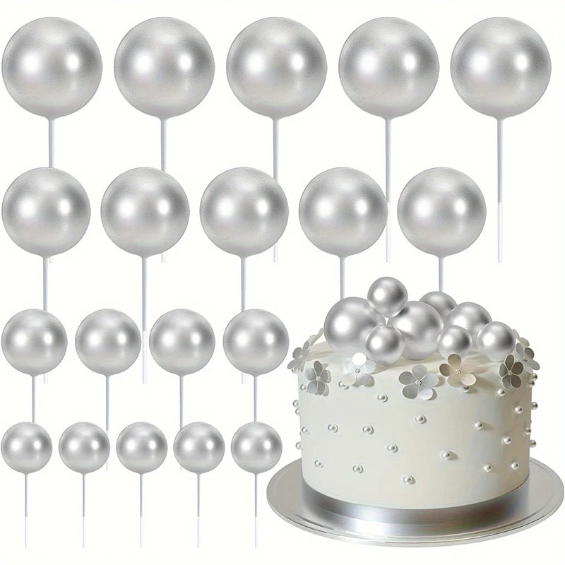 A set of twenty silver ball cake toppers on white sticks arranged in rows.