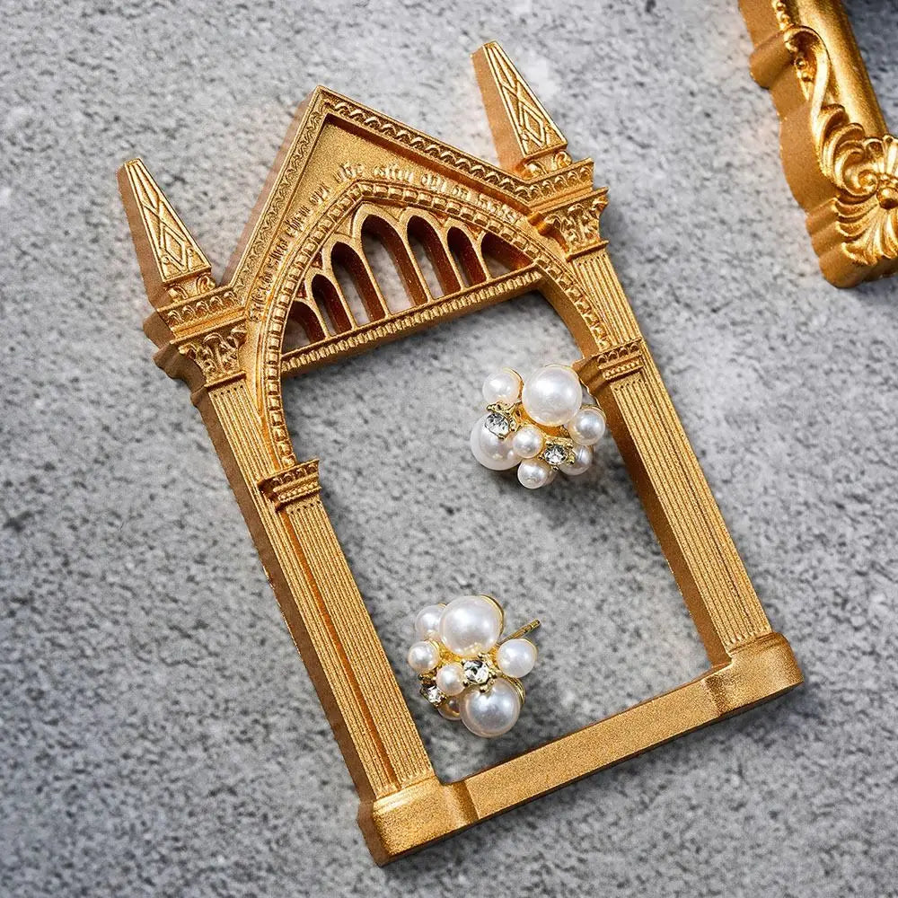 Vintage gold DIY shadow box frame with intricate Gothic arch design and pearl embellishments