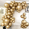 A large balloon garland made of metallic chrome gold balloons displayed indoors.