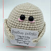 Handmade crochet baseball bat doll with a positivity card featuring the text I may be a tiny potato but I believe in you go d