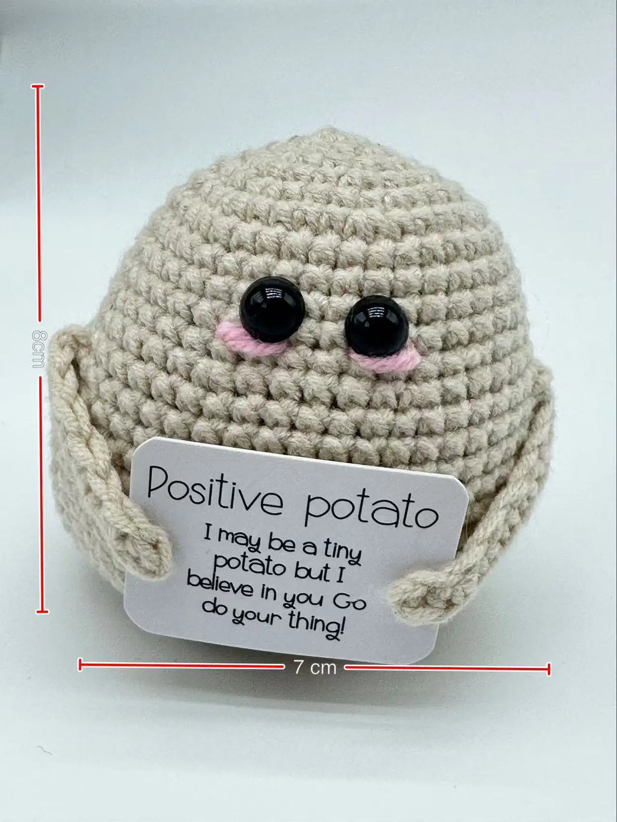 Handmade crochet baseball bat doll with a positivity card featuring the text I may be a tiny potato but I believe in you go d