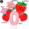 A party kit featuring nine pink and red strawberry balloons, including large fruit shapes and a number balloon.