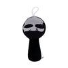 A black plush toy with a silver outline of a face and a loop for hanging.