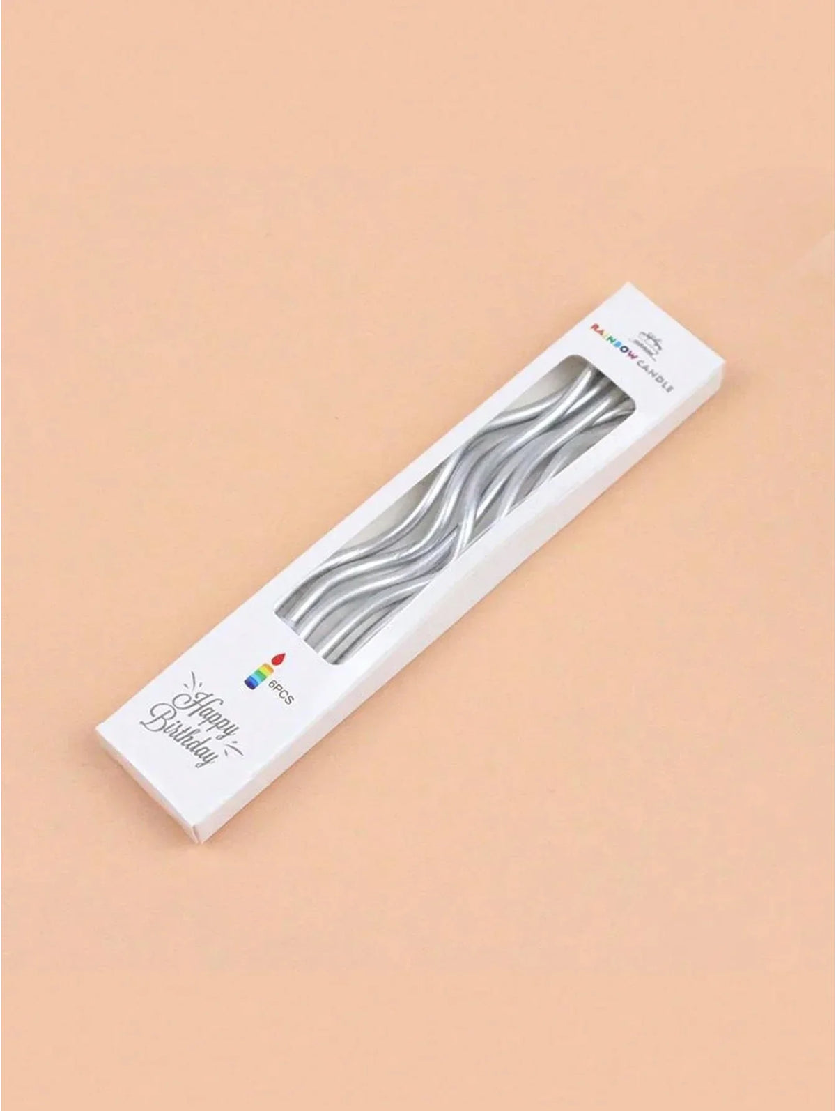 A white box containing a set of silver curved decorative candles for a birthday celebration.