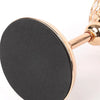A round black crystal candle holder with a golden finish and decorative crystal accents.