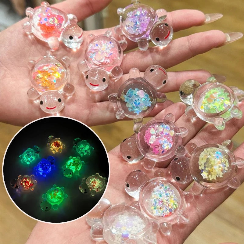 Hands display glow-in-the-dark mini sea turtle figurines for DIY crafts and decor