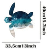 A teal and white turtle sculpture made of rustic iron, displayed against a white background.