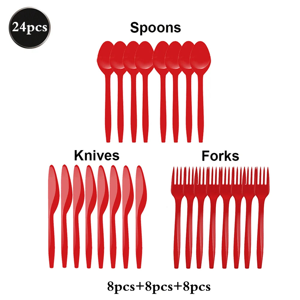 A set of red eating utensils including spoons, knives, and forks for a party.