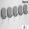 Five gray self-adhesive wall hooks displayed in a row against a white background.