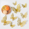 A set of three gold and silver metallic 3D hollow butterfly wall stickers displayed on a white background.