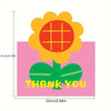 A pink card featuring a large yellow flower with a red center and green leaves, with the text THANK YOU below.