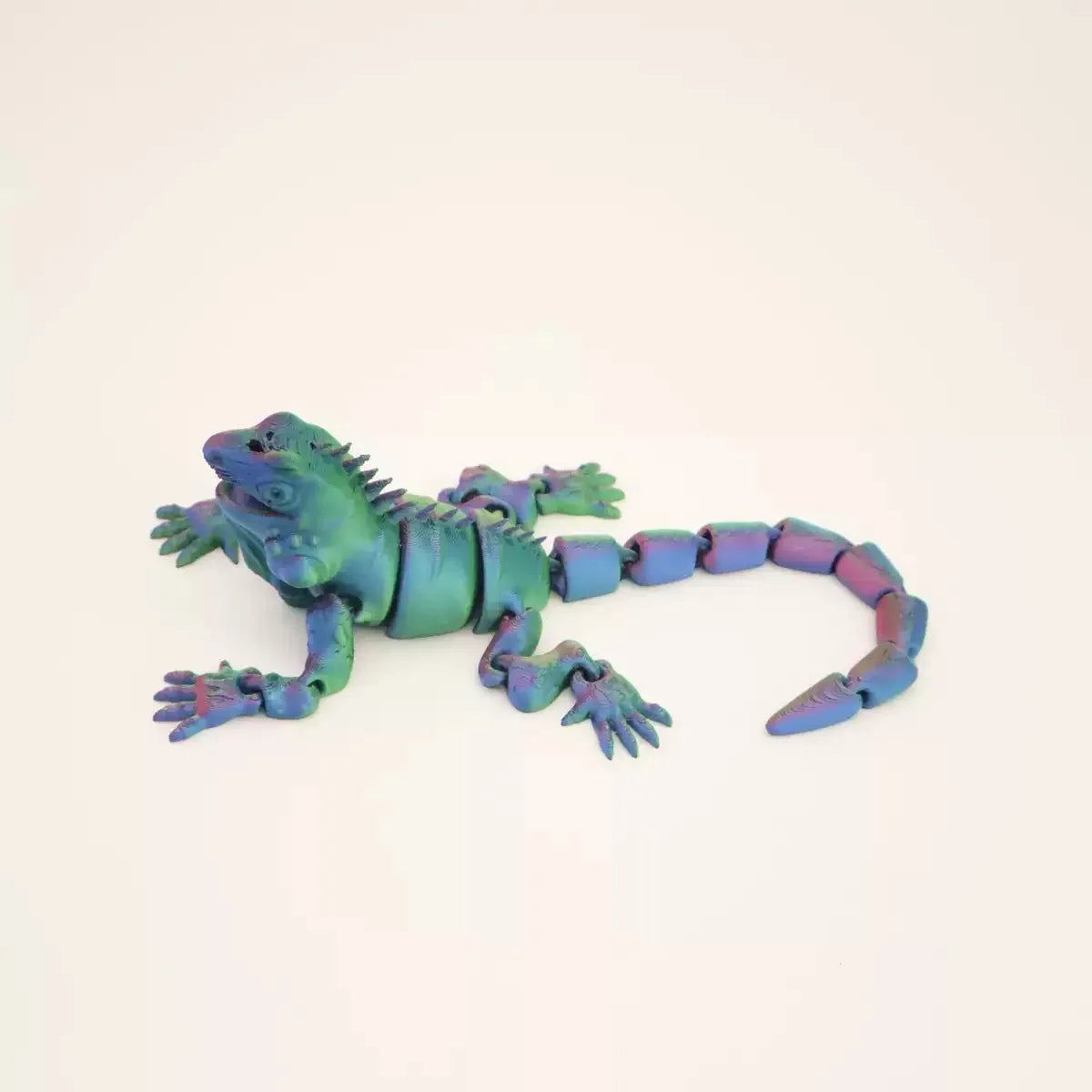 A teal green articulated 3D printed lizard figurine for home decor.
