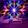 A vibrant fantasy glow-in-the-dark wall tapestry illuminating a modern living room with purple and blue light.