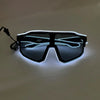 A pair of black sunglasses with glowing blue EL wire outlines on the frame and lenses