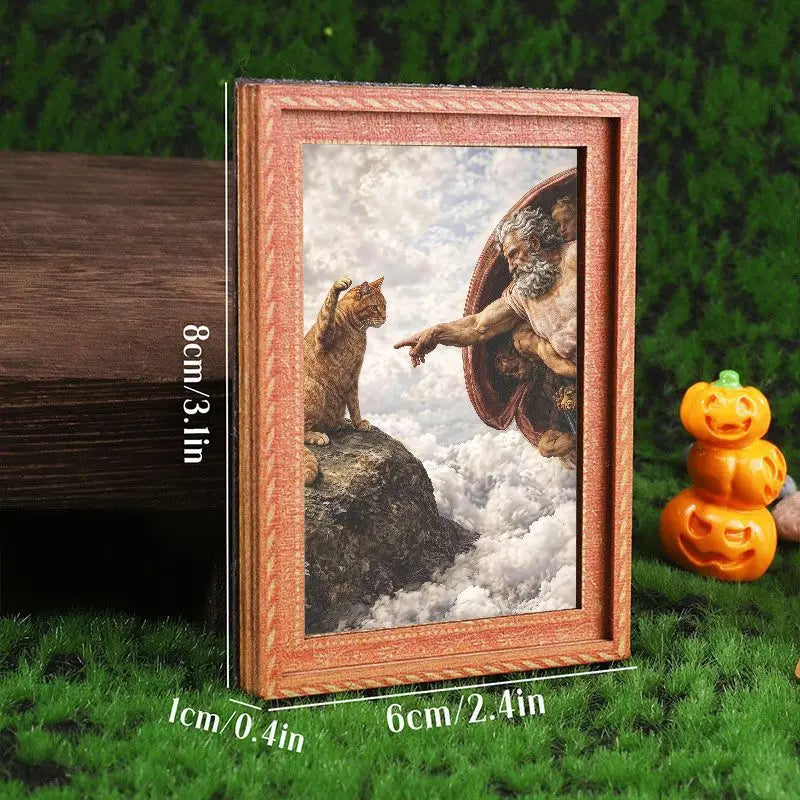A framed art print featuring a cat looking out of a bowl against a cloudy sky, displayed on green grass.