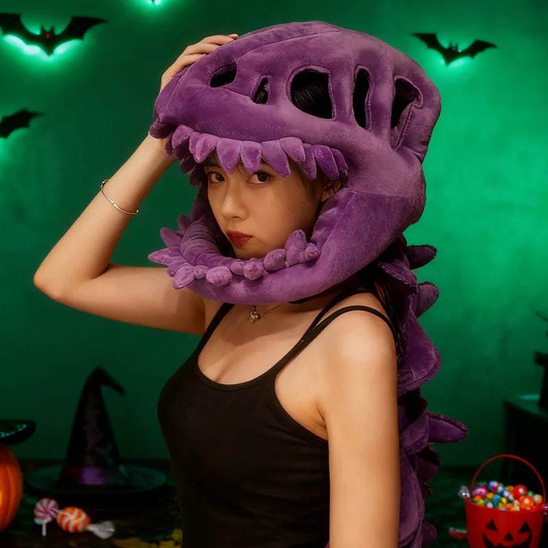 A woman wearing a purple dinosaur skeleton costume headpiece against a green background.
