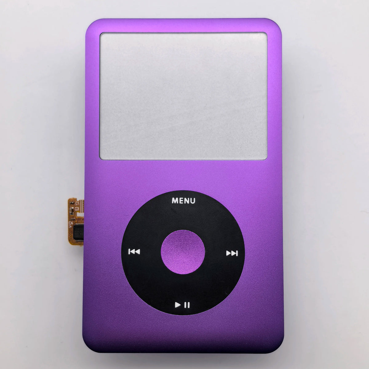 A purple iPod with a silver front faceplate and a black clickwheel replacement kit.