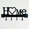Black metal letter sign spelling HOME with four hooks for a wall key holder