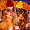 Two women wearing elaborate face paint and flower crowns for festive decor