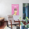 Pink wall tapestry featuring a cartoon duck saying Welcome to my crib above a modern chair.