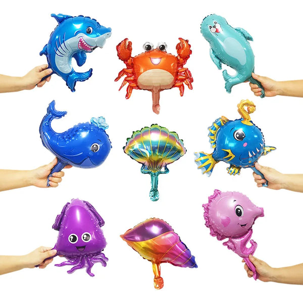 A set of foil balloons shaped like various ocean animals including a dolphin, crab, whale, and octopus.