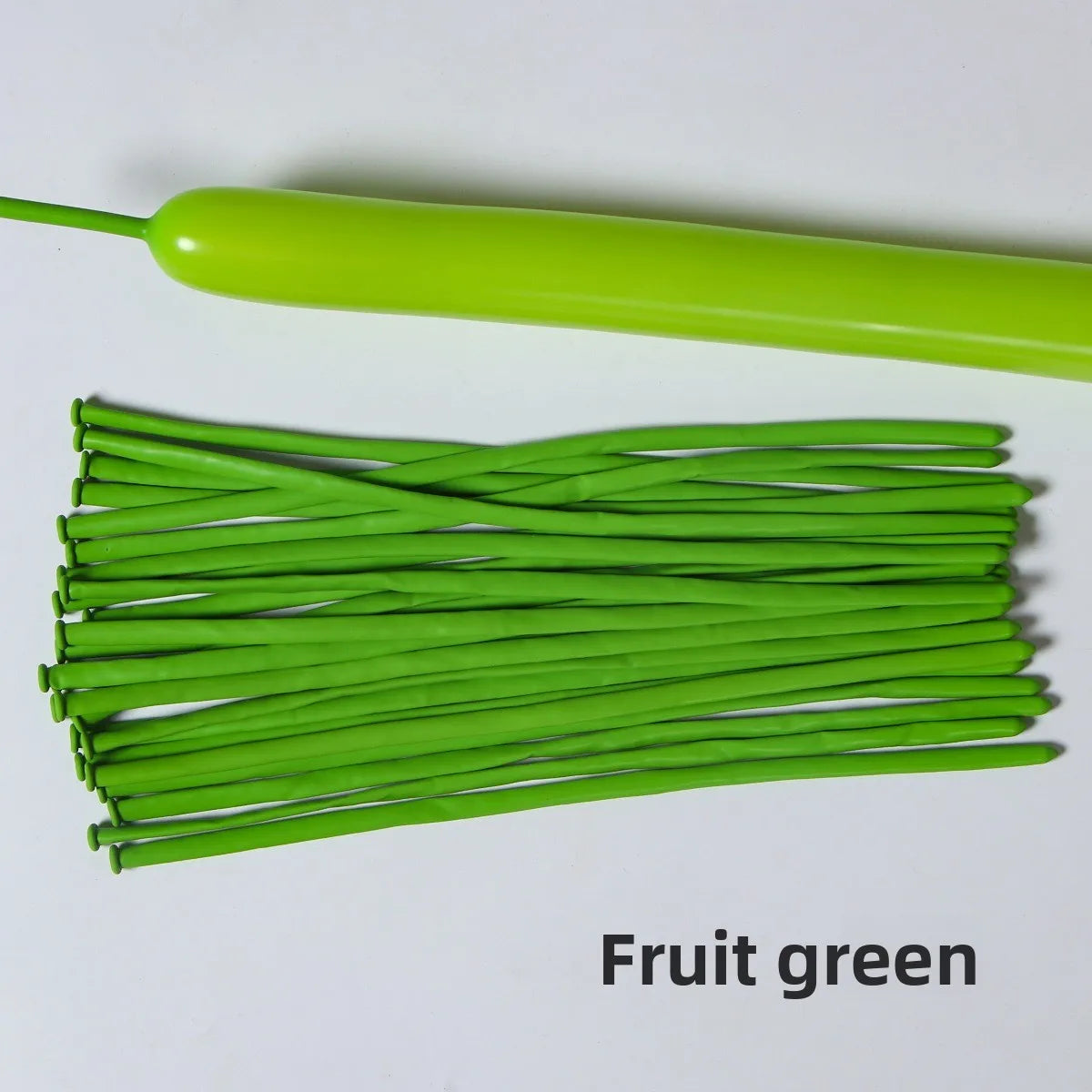 A bundle of bright green latex strip balloons and a green balloon stick.