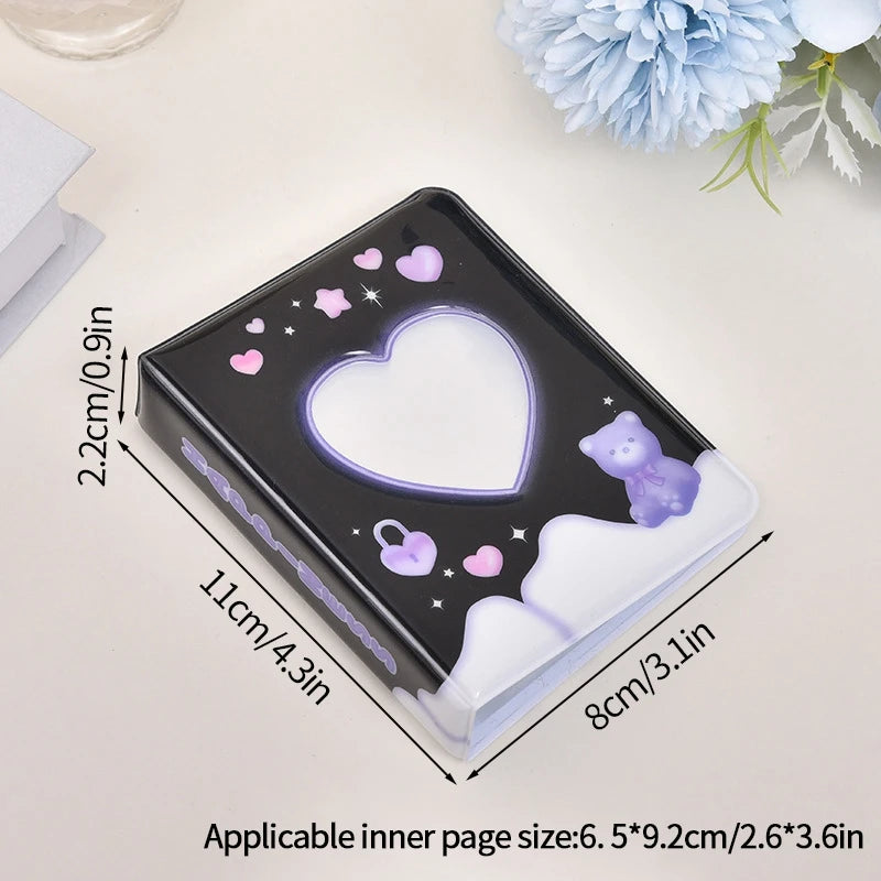 A black photo card album binder with a heart-shaped light feature and purple accents, shown on a white surface.