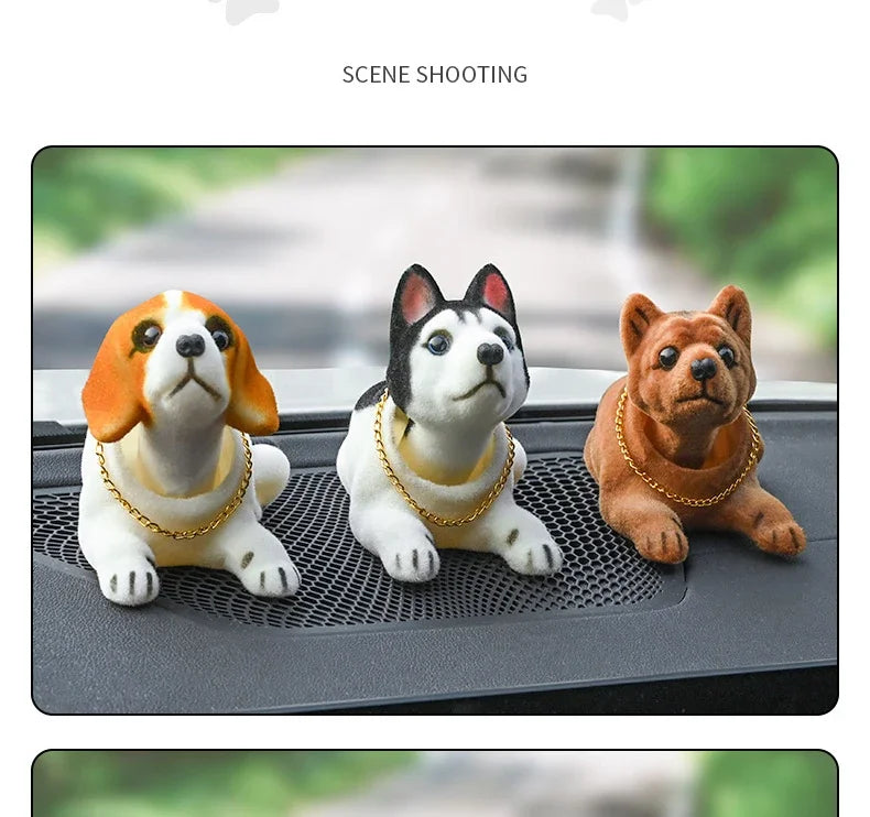 A set of three multi-figure dog ornaments, including a white and orange dog, a white and black dog, and a brown dog, displaye