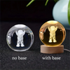 A comparison of a 3D crystal ball night light, shown without a base and with a wooden base.