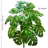 A vibrant green artificial Monstera plant with 24 large silk leaves shown against a white background.