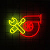 A neon sign featuring a crossed wrench and a stylized 'T' in yellow and red on a dark background.