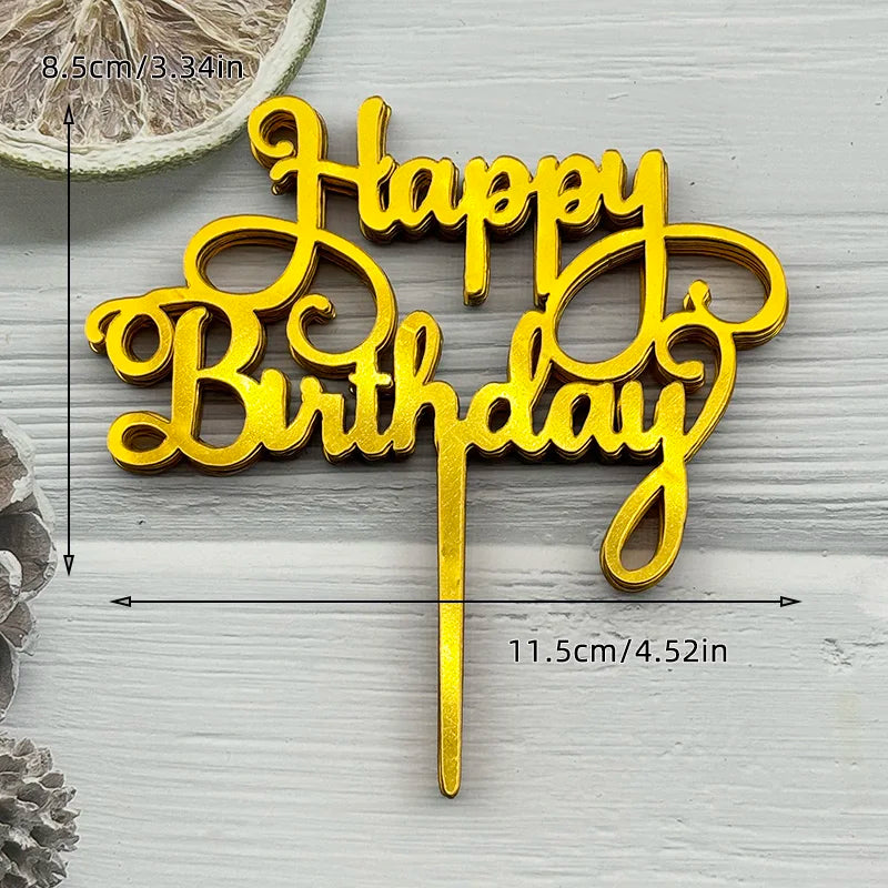 Gold acrylic birthday cake topper with the words Happy Birthday on a stick