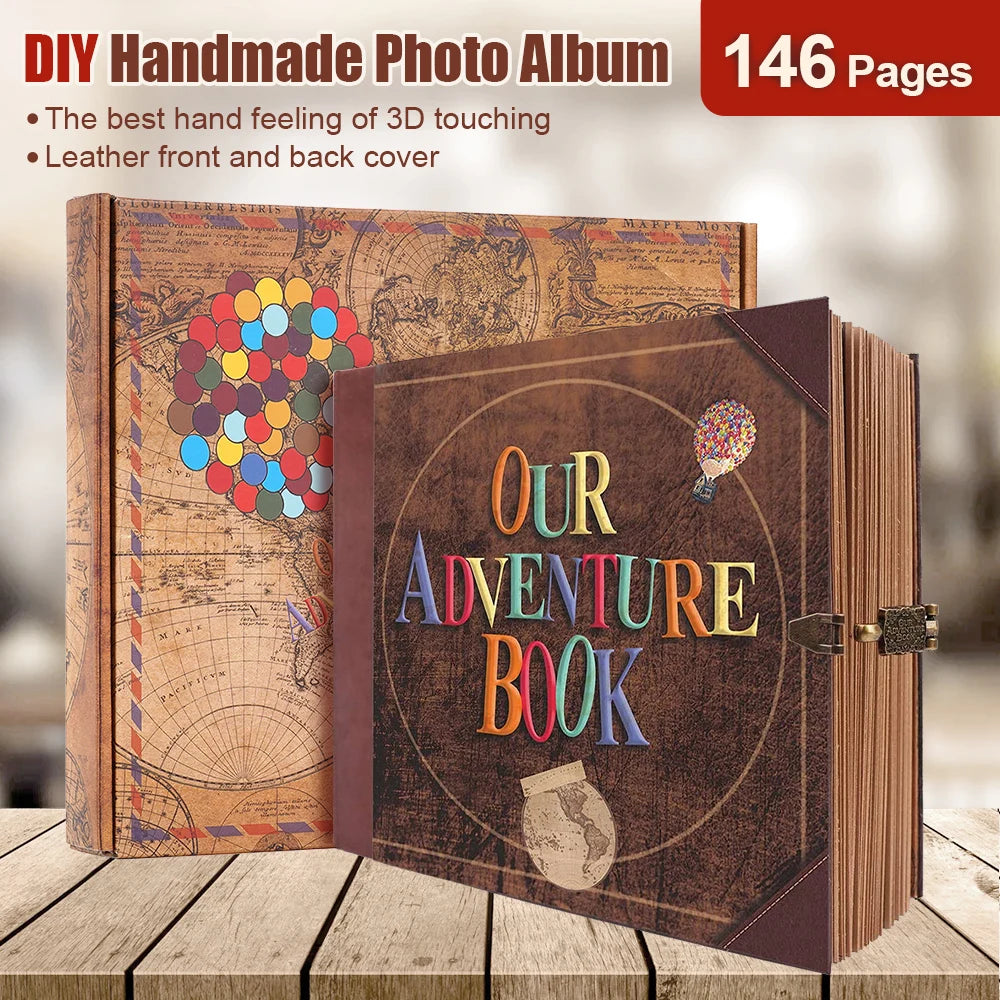 A brown leather photo album titled Our Adventure Book with a globe and a feather, displayed on a wooden surface.