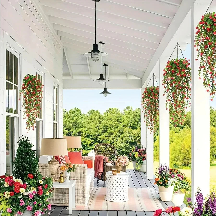 Three lifelike faux eucalyptus hanging plants displayed in a bright porch setting.