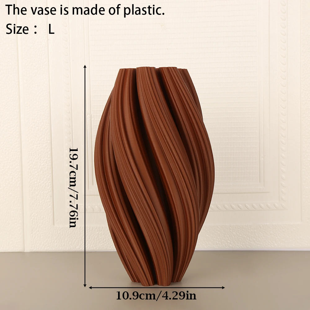 A terracotta-colored, textured wave vase with a narrow base and flared opening.