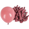 A bunch of pink latex balloons is shown next to a single large pink balloon.