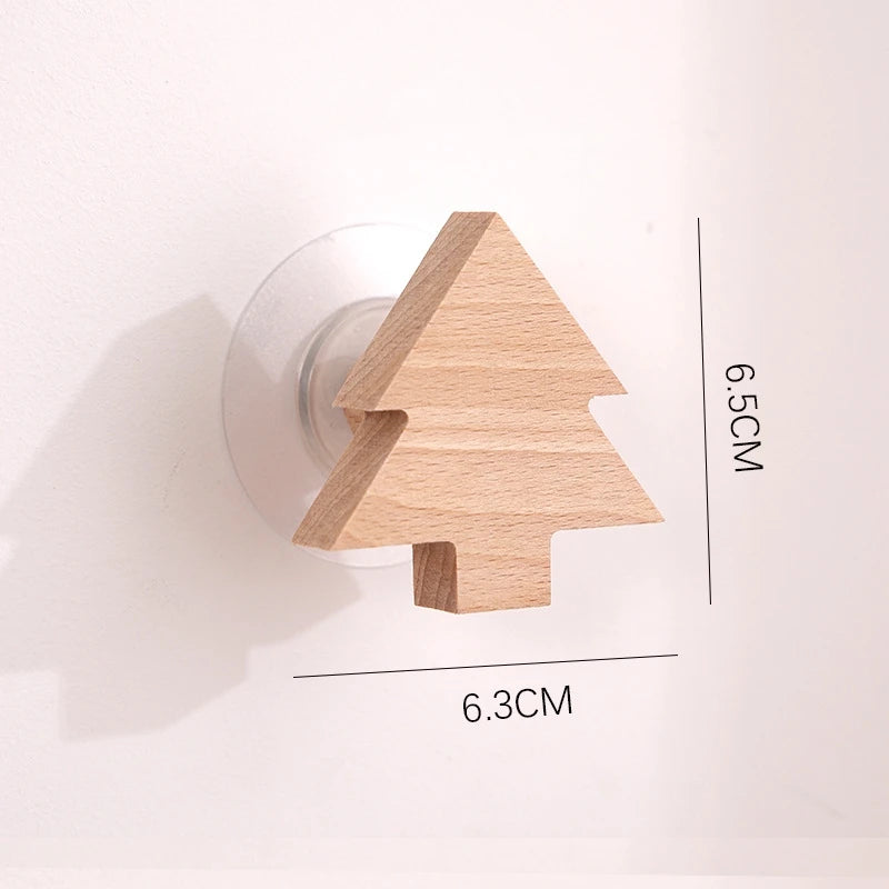 A light wood decorative arrow-shaped hook with dimensions 6.5cm by 6.3cm.