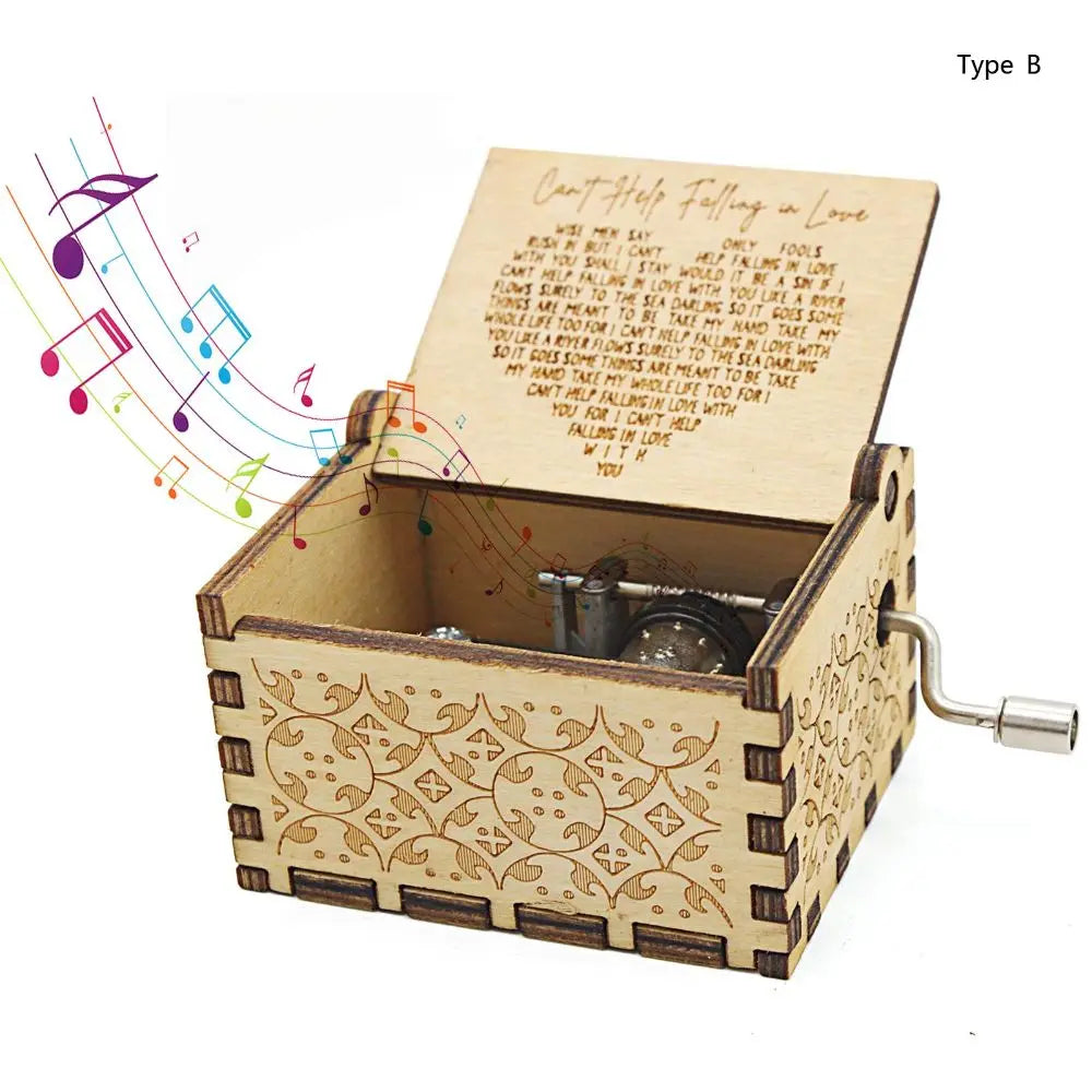 A vintage hand-cranked wooden music box featuring the lyrics Can't Help Falling in Love.