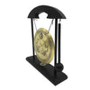 Black desktop zen gong hanging from a wooden mallet on a stand