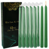 A box of 12 pack of 10 inch drip-less taper candles in a dark green color.