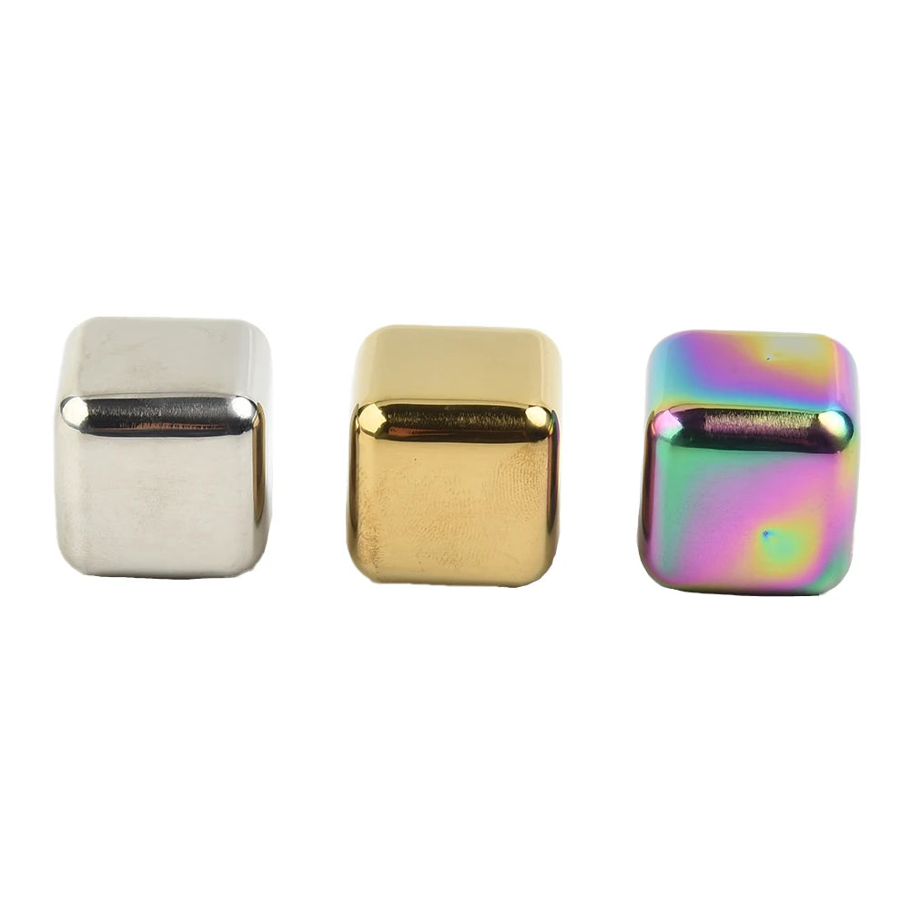Three rectangular ice cubes in silver, gold, and iridescent colors.